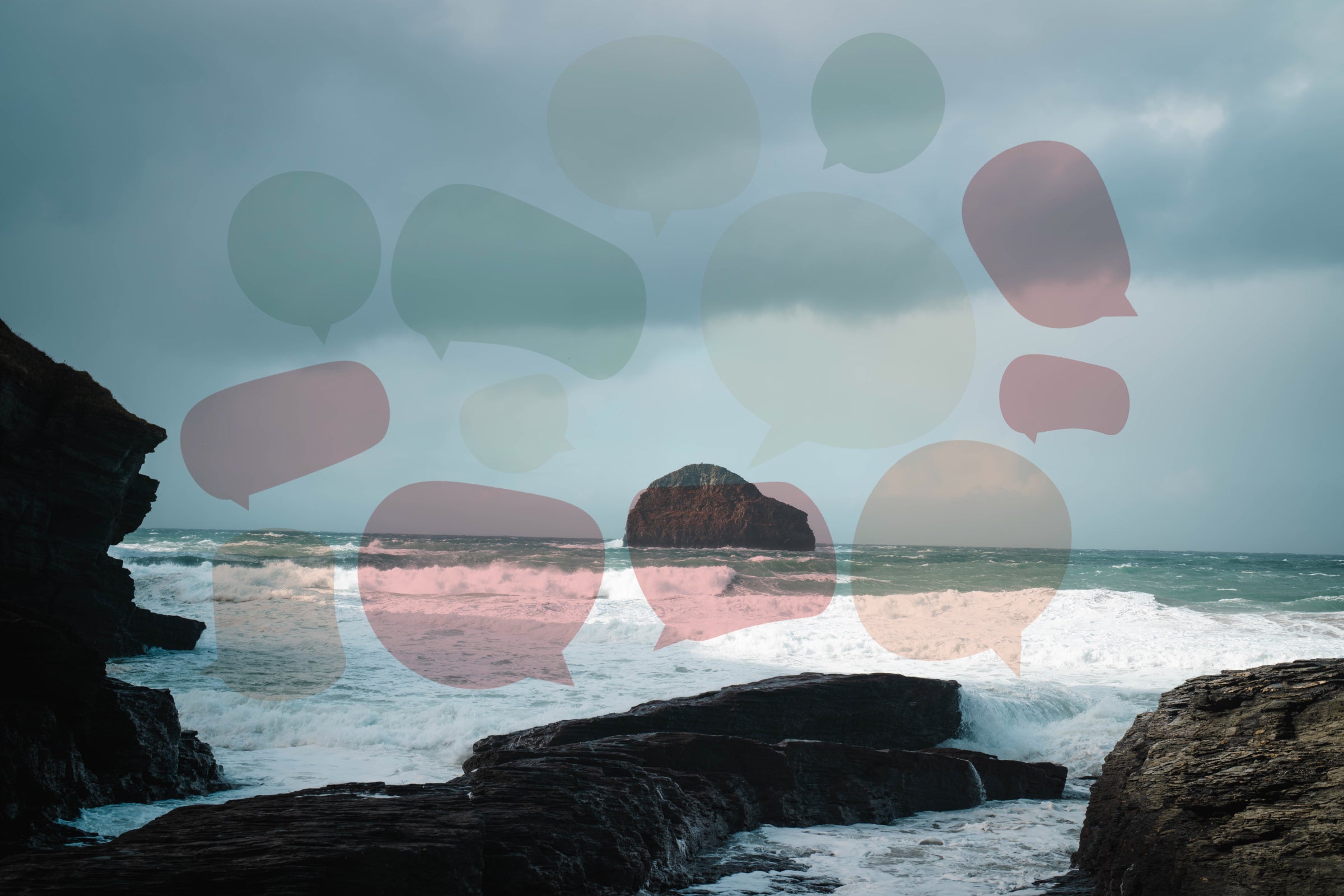 A landscape shot of the ocean with an array of speech bubbles floating around