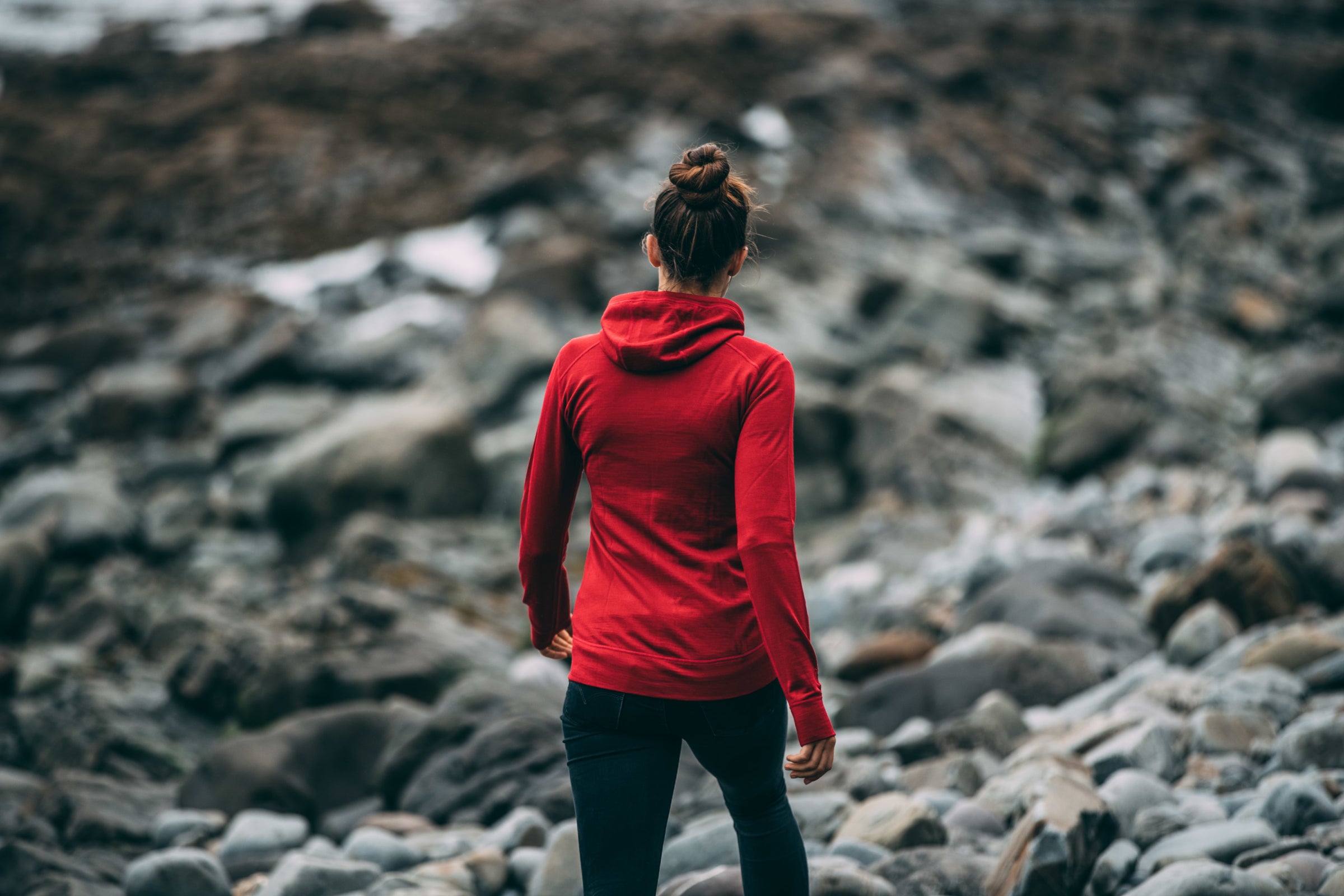 Person wearing a red Isobaa merino hoodie