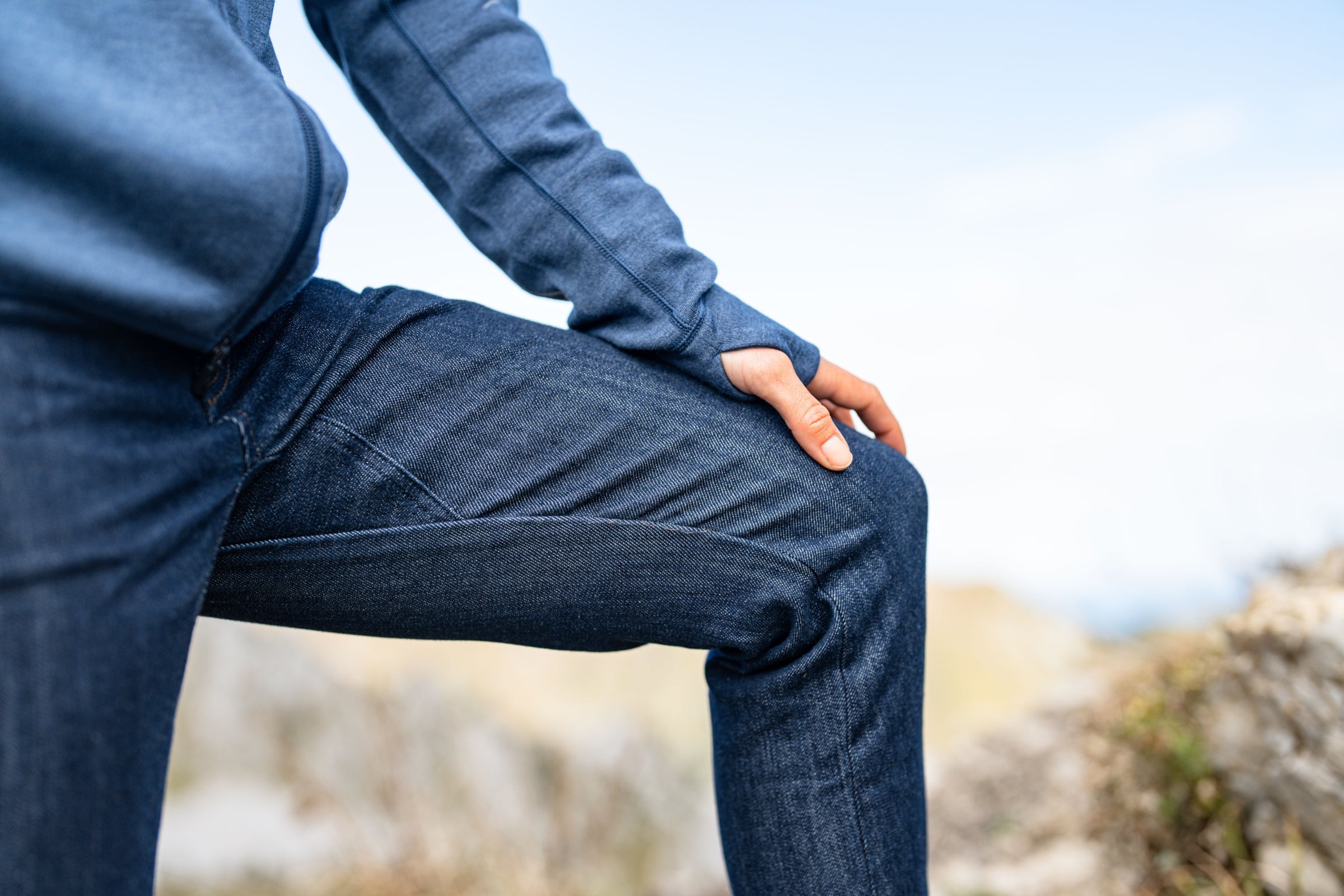 Close-up of knee in Merino blend jeans