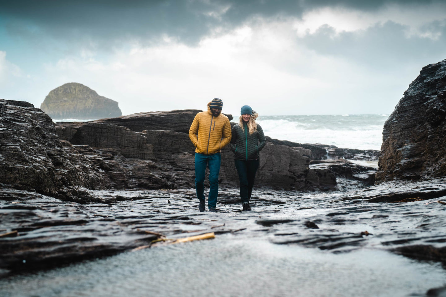 Isobaa Merino Insulated Jacket worn on a wet and windy beach day