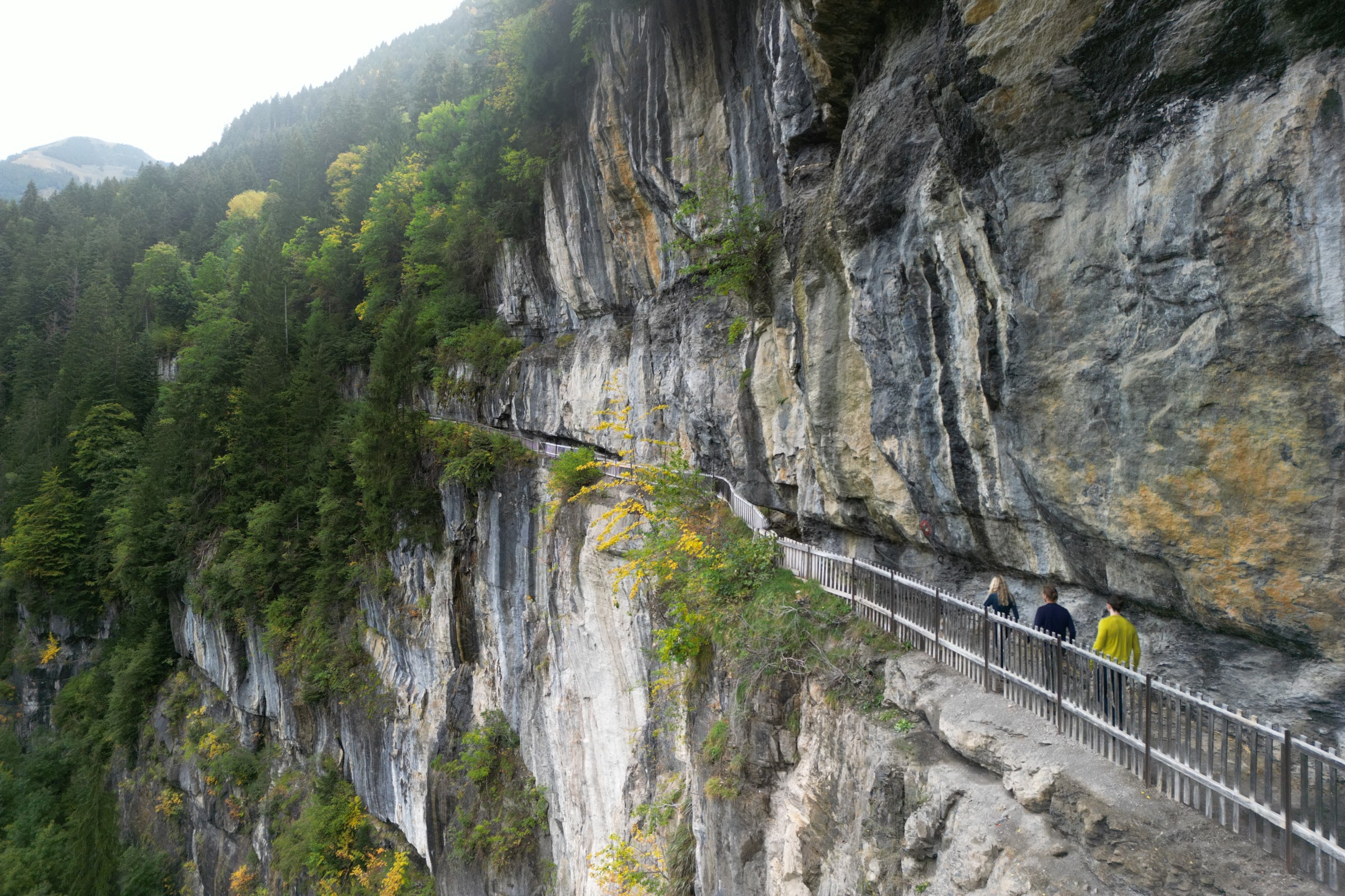 Hikers on a narrow cliffside path