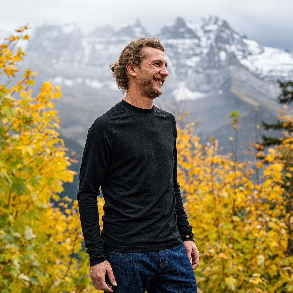 Isobaa | Mens 160 Merino Active Long Sleeve Crew (Black) | Elevate your active wardrobe with our Men's 160 Merino Active Long Sleeve Crew, expertly crafted from 160g 18.5 micron superfine merino wool | Model: Baudoin