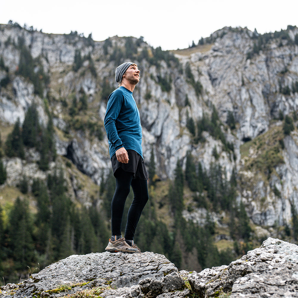 Isobaa | Mens 160 Merino Active Long Sleeve Crew (Petrol) | Elevate your active wardrobe with our Men's 160 Merino Active Long Sleeve Crew, expertly crafted from 160g 18.5 micron superfine merino wool | Model: Baudoin