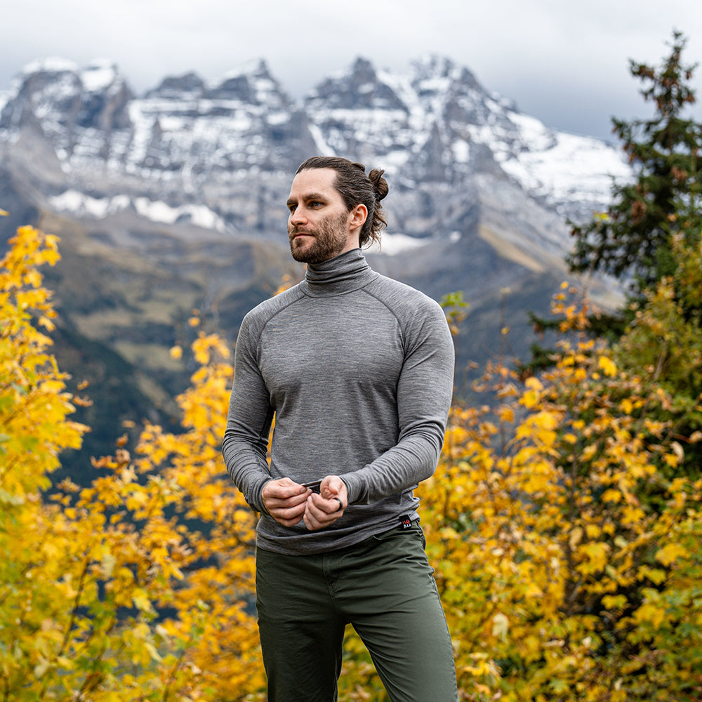 Isobaa | Mens 160 Merino Active Roll Neck (Charcoal Melange) | Embrace the chill in style with our Men's 160 Merino Active Roll Neck, crafted from 160g 18.5 micron superfine merino wool | Model: Ed