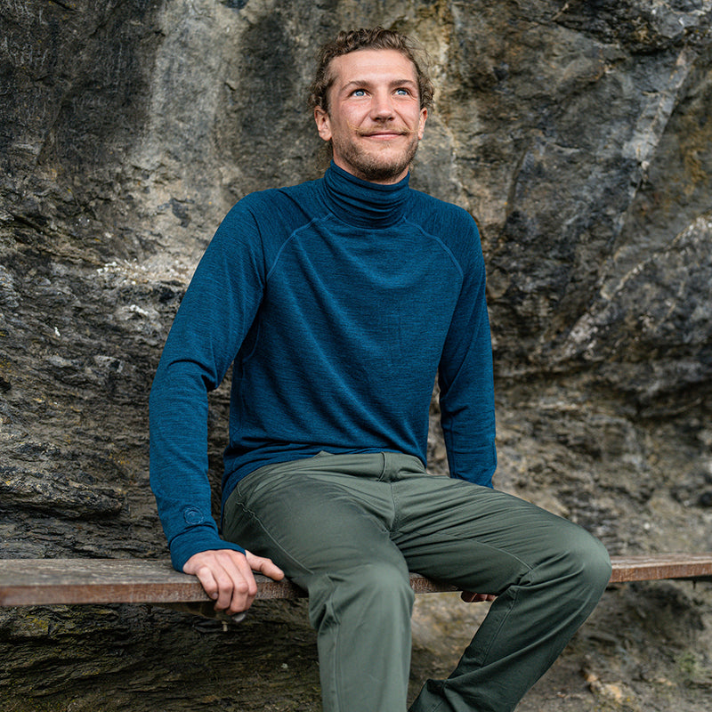 Isobaa | Mens 160 Merino Active Roll Neck (Petrol) | Embrace the chill in style with our Men's 160 Merino Active Roll Neck, crafted from 160g 18.5 micron superfine merino wool | Model: Baudoin