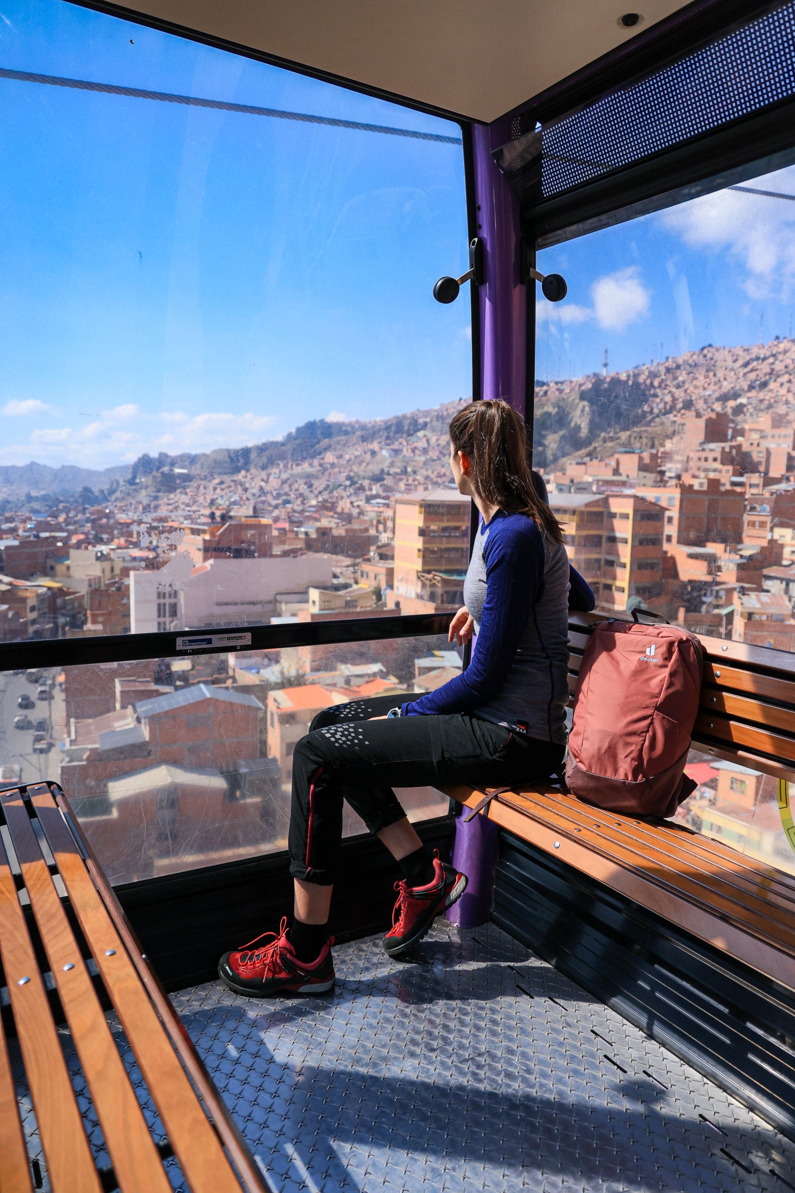 Tiphaine on a cable car – Overlooking a city from a gondola