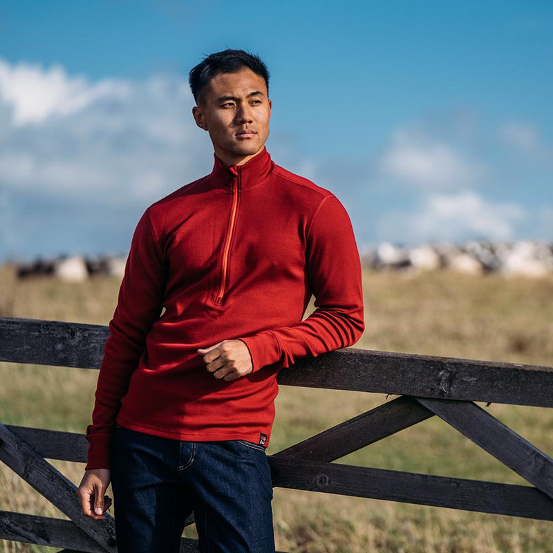 Isobaa | Mens Merino 320 Long Sleeve Half Zip (Red/Orange) | Conquer cold trails, blustery commutes, and unpredictable weather with the ultimate Merino wool half-zip top.