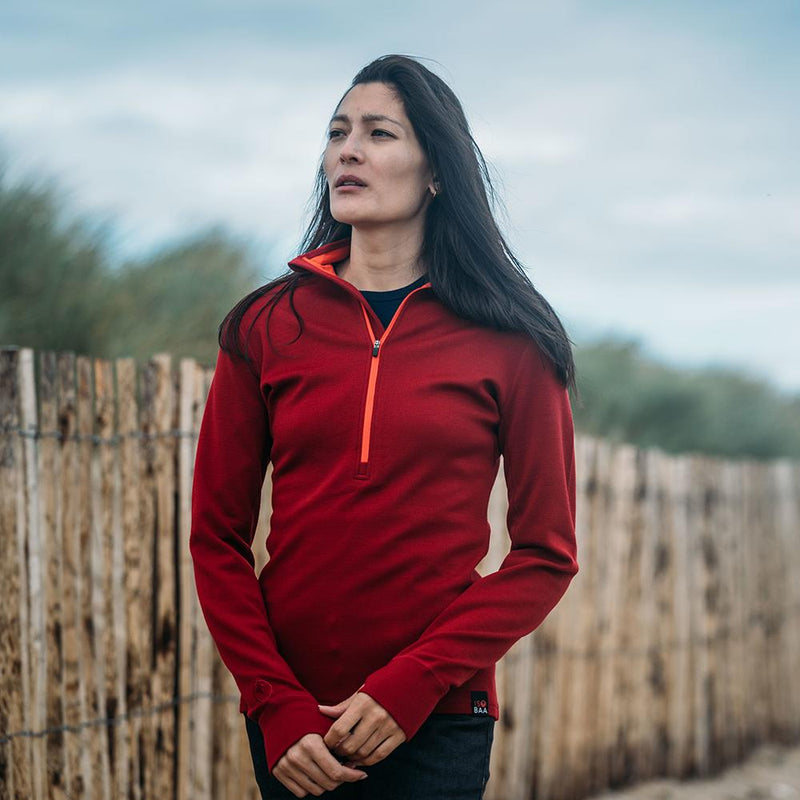 Isobaa | Womens Merino 320 Long Sleeve Half Zip (Red/Orange) | Conquer cold trails, blustery commutes, and unpredictable weather with the ultimate Merino wool half-zip top.